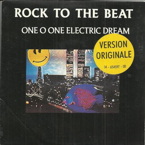 Version Originale : Rock To The Beat (New Beat Mix) Saunderson - Echols) 3:54 / Business Man (P; Selinger - Y. Van Den Berg) 3:32