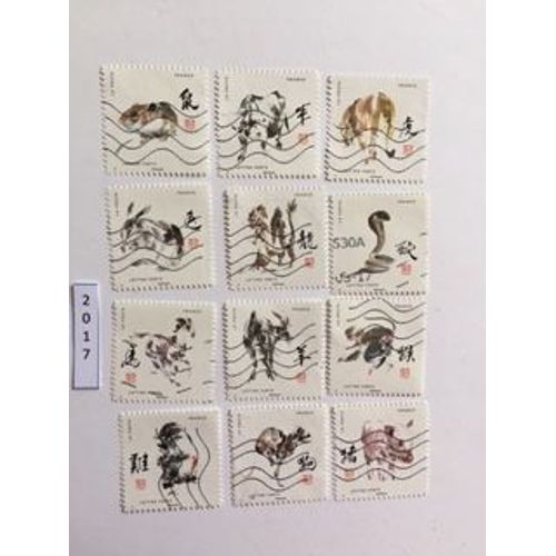 Série Complète De 12 Timbres Oblitérés