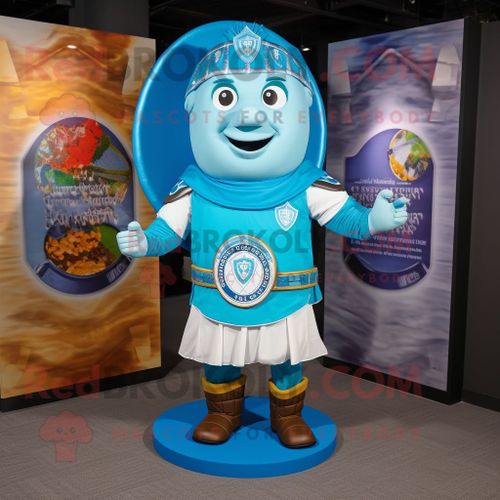 Personnage De Costume De Mascotte Redbrokoly De Bouclier Celtique Bleu Ciel Habillé D'une Chemise Henley Et D'écharpes