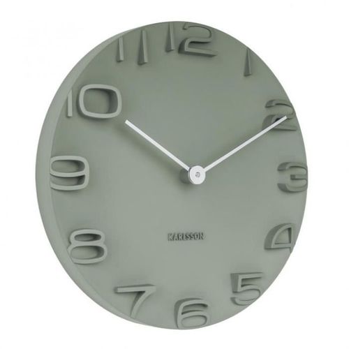 Une horloge murale en plastique moulé qui fait ressortir les chiffres en 3D