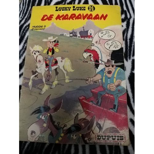 Bande Dessinée Lucky Luke 24. 1970. De Karavaan. Version Néerlandaise.
