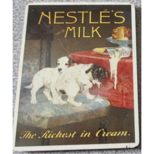 Aimant/Magnet Métallique Publicitaire Vantant Le Lait Nestlé Riche En Crème Avec Deux Petits Chiens Espiègles Se Délectant D'une Boite De Lait Renversée - Textes En Anglais - 6x8cm