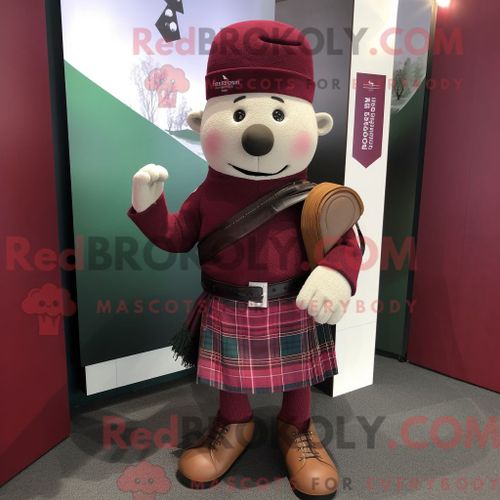 Personnage De Costume De Mascotte Redbrokoly De Cornemuse Marron Habillé Avec Un Jegging Et Des Pochettes De Costume