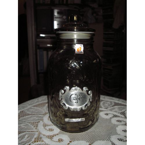 Bocal À Café En Verre Épais ,Décor En Relief ,Plaque En Étain Pur Gravée " Café " ,De Marque Orwal Décor ,De Couleur Transparent Nuancé Marron ,Bouchon Hermétique  ,Hauteur 23 Cm ,Diamètre Base 7,5 Cm