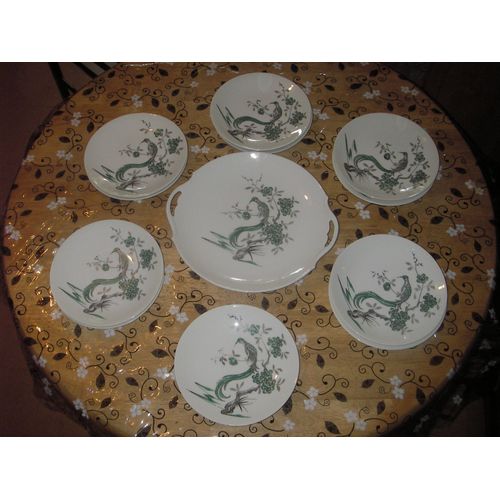 Service À Dessert En Porcelaine De Limoge 12 Pièces ,1 Plat À Tarte Avec Anses De Chaque Côté ,11 Assiettes Assorties ,Décor Peint À La Main ,Motif :Oiseau Des Îles Sur Branche En Fleurs .