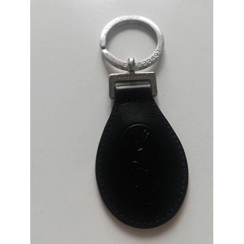 Porte clefs longchamp noir. Jamais utilisé.