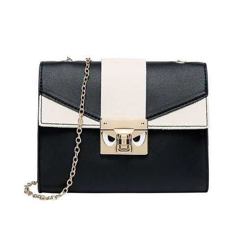 Sac à main en bandoulière bicolore pour femme.