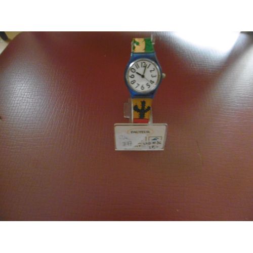 Montre Enfant Mixte Affichage Analogique Quartz Cadran Fond Blanc Tour Bleu Bracelet Plastique Cactus Dauteuil Lcd003c