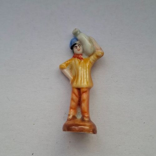 Fève - Santon - Nativité Santons Crèche - Santon Personnage Homme Bonnet Bleu Pantalon Orange Veste Orange Sac De Farine Sur L Epaule Socle Marron Ref%19