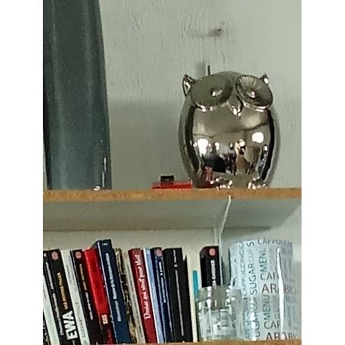 Petite sculpture en métal argenté représente une chouette hauteur 20,largeur 12cm