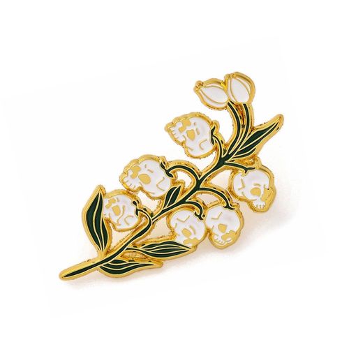 Pin's Muguet Têtes De Mort