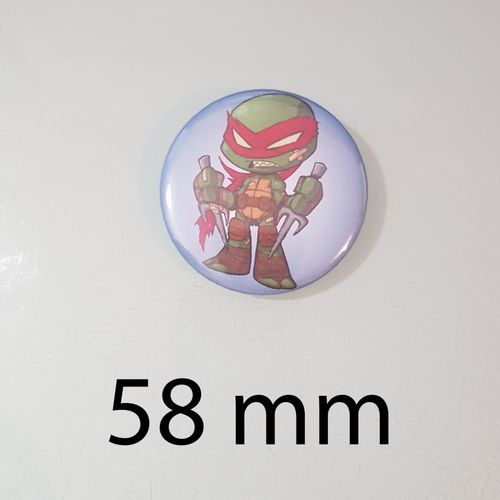 Un Badge Coloré De Raphaël, Le Ninja Rebelle Des Tortues Ninja - Badge 58 Mm