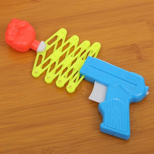 Rétractable En Plastique Ressort Poing Shooter Drôle Fête Enfant Enfants Trick Jouet Cadeau