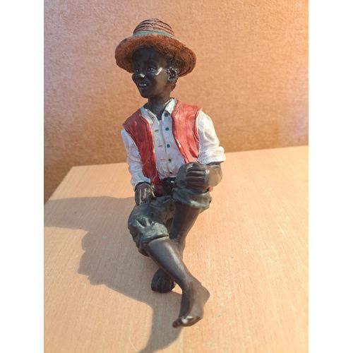 Statuette en résine personnage de couleur assis