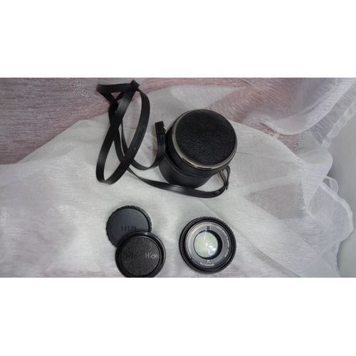 objectif le fameux minolta md rokkor 50mm 1:1.7 + cache optique + housse
