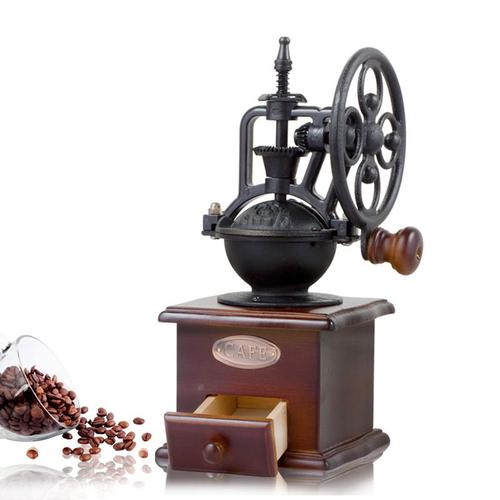 Moulin à café manuel vintage avec grains de café et épices avec manche en bois et noyau en céramique