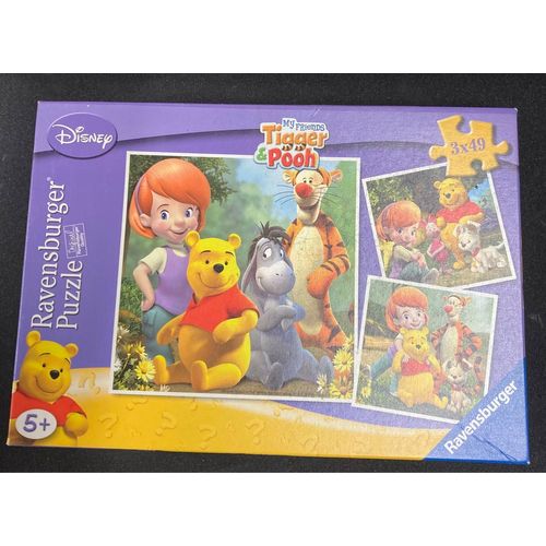 Trois. Puzzle Winnie, L¿Ourson Ravensburger.