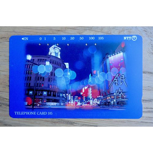 Superbe Télécarte Ancienne Japon. Ville De Nuit, Temple Japonais, Lettres Japonaises Rues Illuminées. 105 "231-111". Télécarte Japonaise 1990. Télécarte Ville De Nuit Japon.