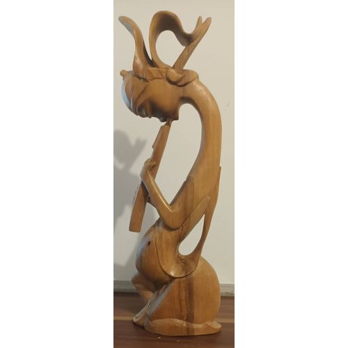 Sculture en bois joueur de flute asiatique