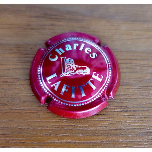 Capsule De Champagne 1/4 Charles Laffite. Noir Et Argent. Lion. Assez Rare.