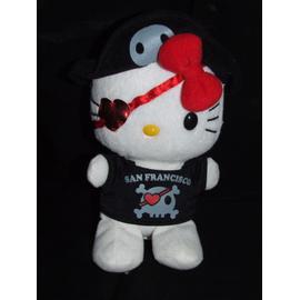 Doudou Hello Kitty blanche salopette rouge petit sac rose Sanrio