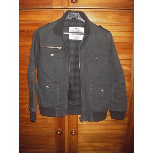 Blouson Mi Saison Original Overgame Brand De Couleur Gris Passé ,Doublure Vert Écossais ,Taille 12 Ans .