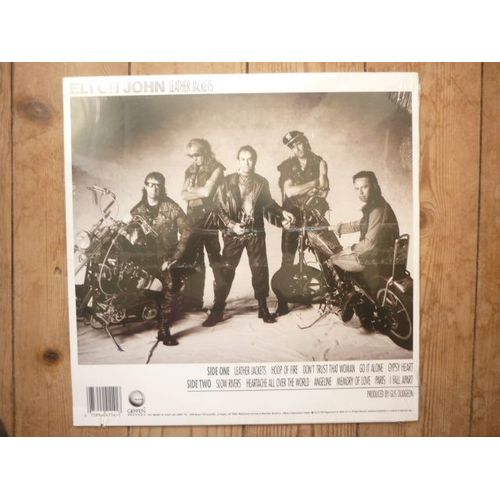 Disque Vinyle 33t Leather Jackets / Hoop Of Fire / Don't Trust That Woman / Go It Alone / Gypsy Heart / Slow Rivers / Heartache All Over The World / Angeline / Memory Of Love / Paris / I ...