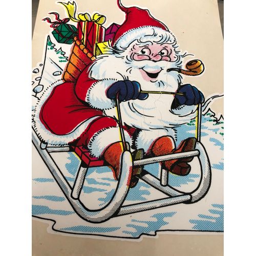 Autocollant sticker adhésif pere noël avec une pipe sur un traineau Autocollant sticker adhésif pere noël avec une pipe sur un traineau