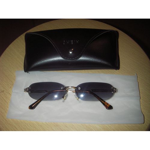 Lunettes De Soleil De Forme Ovales, Sans Bords, Branches Fixes Par Clous  Mme Le Verre, Coloris Argentes, Bouts Des Branches cailles Et Leurs tui  Lunettes Pressionn De Marque Shein.