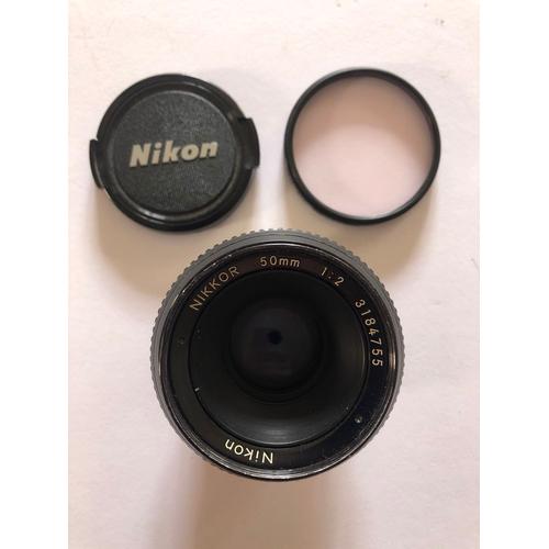 Objectif Nikon Nikkor 50mm 1:2 + cach de protection + filtre Hoya Hmc 52mm 