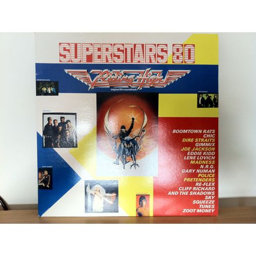 Superstars 80 Riding High Soundtrack  Details Keep It Up, Pulling Muscles, I'm The Man, Dreaming, Night Steppin' Heavy Metal, Goos Times, Give It To Me Willie And The And Jive Wiz Kid, Toccata  Solid - Police, Sire Straits, Boomtown Rats, Garu Numa, Sueeze, Joe Jackson, Pretenders, Cliff Ricahrd & The Shadows, Runes, Eddie Kiddn Madness, Chic, Lene Lovich Zoot Money, Nrg, Sky, Gimmix Re-Flex,