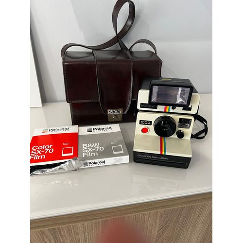 Polaroïd 1000 land caméra supercolor, un avec son flash.