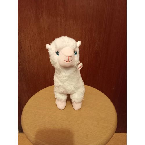 Lama musical LAMADOO, coloris blanc, museau, bas de pattes, et oreilles roses, yeux et museau brodés, musique par pression sur le ventre, hauteur 22 cm, longueur 17 cm, largeur 8 cm.