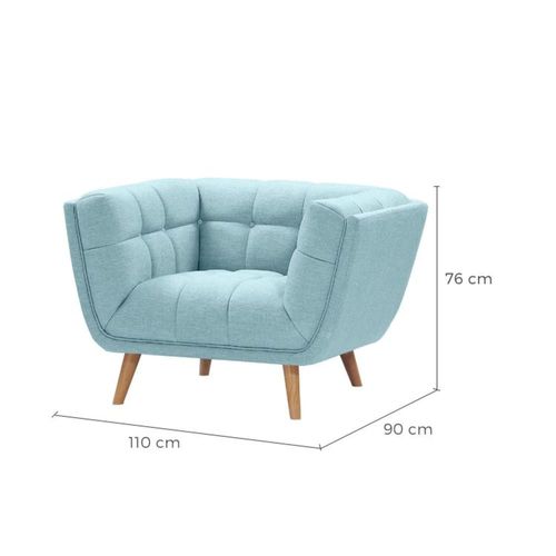 Fauteuil capitonné en tissu bleu clair