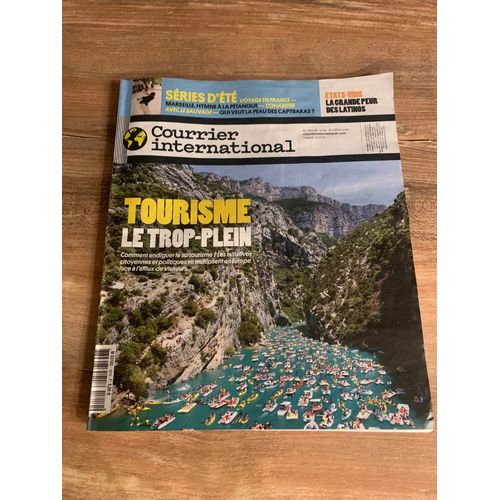 Vends   Magazine  Courrier International   ´´   Tourisme Le Trop Plein    ´´   