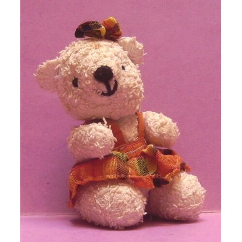 Figurine / Peluche Oursonne Assise Avec Robe Et Noeud - 10 Cm