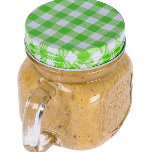 Nourriture Pour Oiseaux Beurre De Cacahuète Dans Un Mug En Verre - Vert