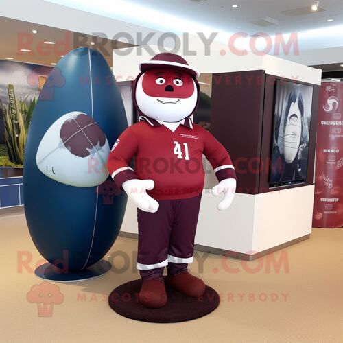 Personnage De Costume De Mascotte Redbrokoly De Ballon De Rugby Marron Habillé D'un T-Shirt À Manches Longues Et De Carrés De Poche