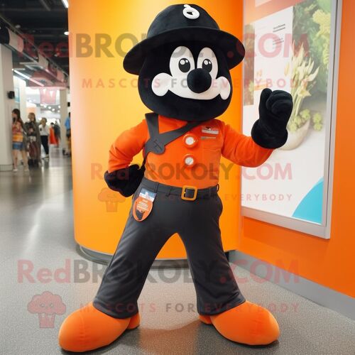 Mascotte Redbrokoly De Personnage Orange Noir Habillé D'un Jean Flare Et De Bérets