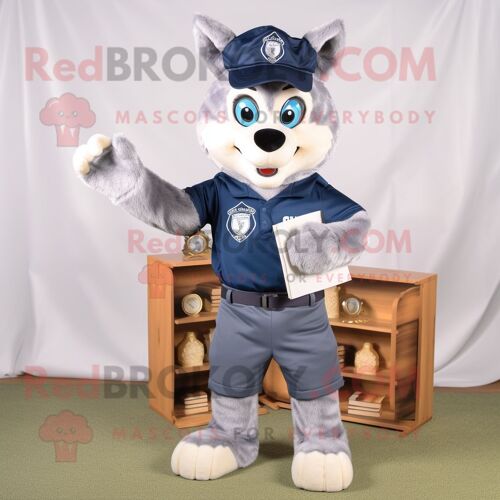 Mascotte Redbrokoly De Personnage Bleu Marine Say Wolf Habillé D'un Pantalon Chino Et De Lunettes De Lecture
