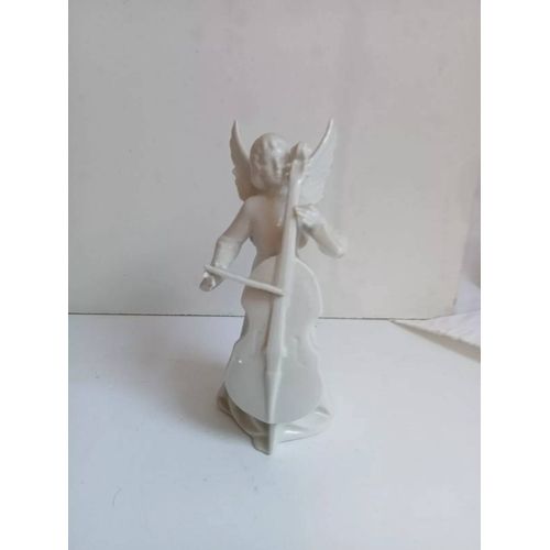 statuette en faience émaillé blanc signé hauteur 14 cm largeur 6 cm 165 gr