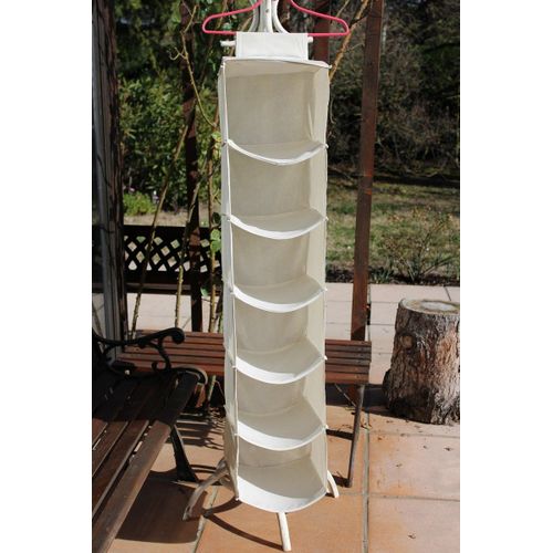 Suspension de rangement en tissu écru avec bandes auto agrippantes .