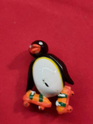 Figurine Pingouin Roller