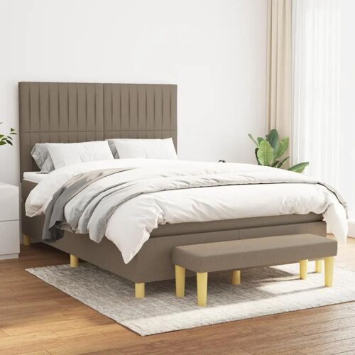 Lit tapissé taupe, tête réglable, matelas mousse + ressorts, confort moyen-ferme.