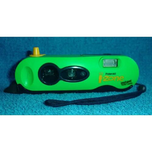 Appareil-photo Polaroïd I-Zone instant pocket caméra avec mode d'emploi au verso de couleur verte Tomy flash & focus automatic