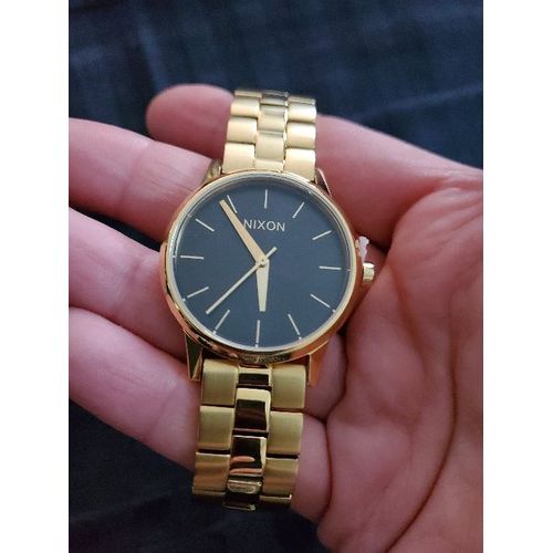 Nixon  Montre À Quartz En Acier Or Gold Doré Fond Noir 3.2 Cm