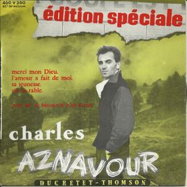 Édition Spéciale : Merci Mon Dieu (Charles Aznavour) - L'amour A Fait De Moi (P. Roche - Ch. Aznavour) / Sa Jeunesse (Ch. Aznavour) - Sur La Table (Ch. Aznavour)
