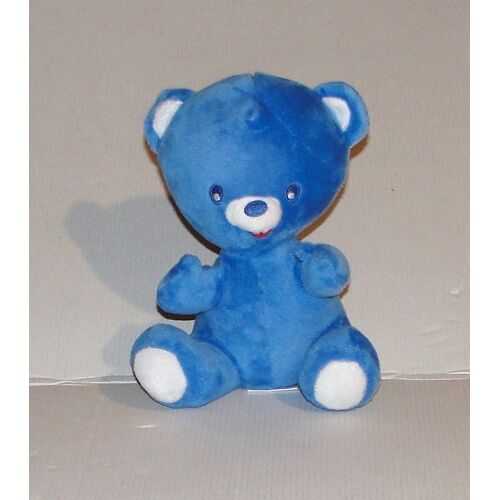 peluche ours nestlé assis yeux ronds