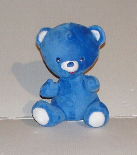 peluche ours nestlé assis yeux ronds