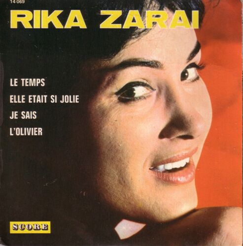 Le Temps 2'26 (C. Aznavour, J. Davis) - Elle Était Si Jolie 2'50 (A. Barrière)  /  Je Sais 2'18 (E. Seggian, N. Péridès, M. Falconier) - L'olivier 2'50 (M. Mérane, E. Marnay, L. Missir)